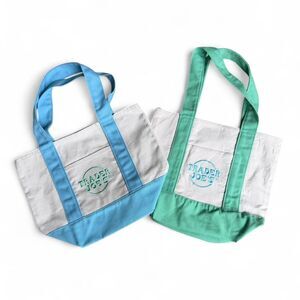 Trader Joe's blue & white canvas tote bag and green and white canvas tote bag